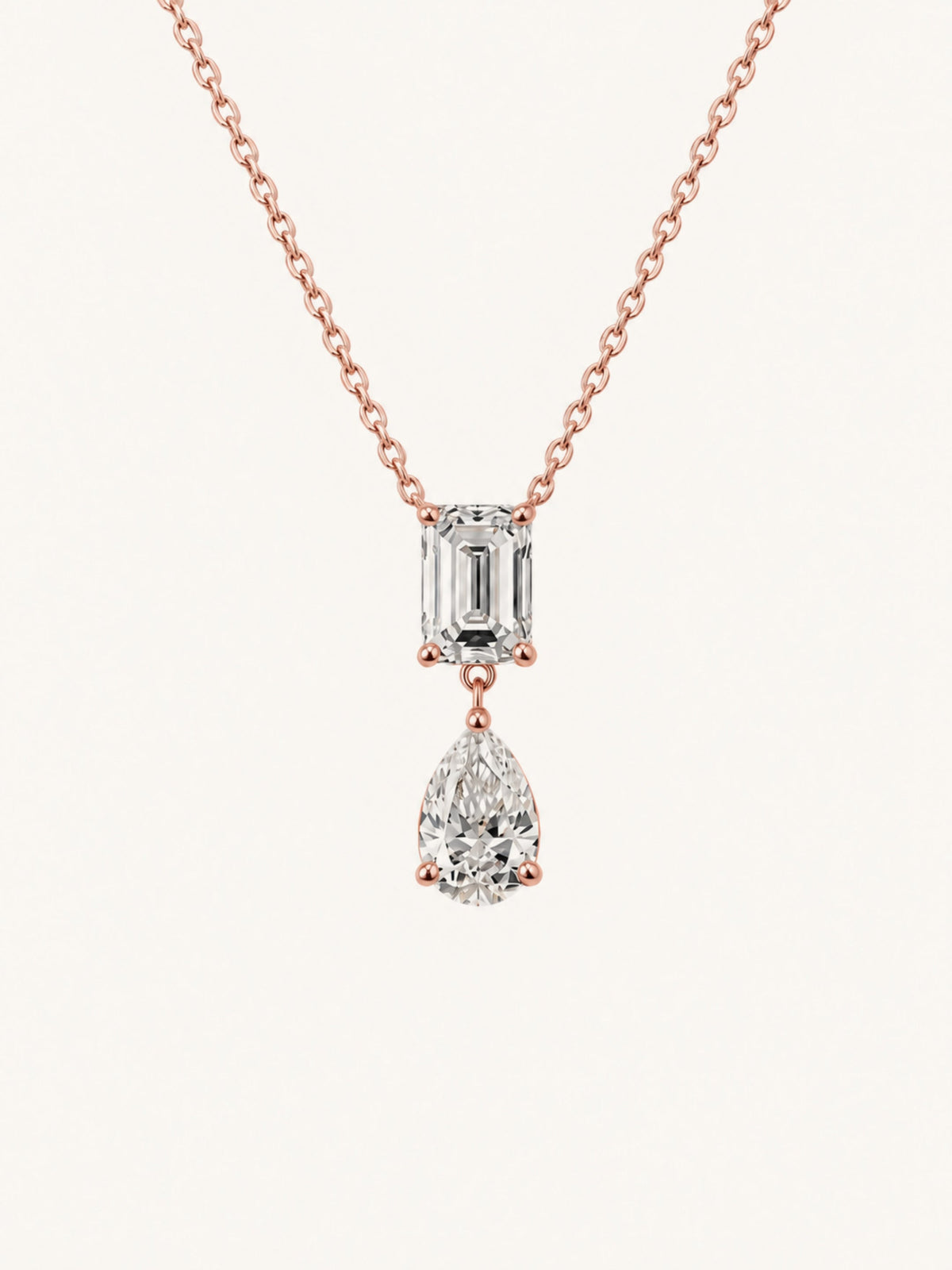 Emerald cut and pear lab diamond pendant necklace in 14k rose gold