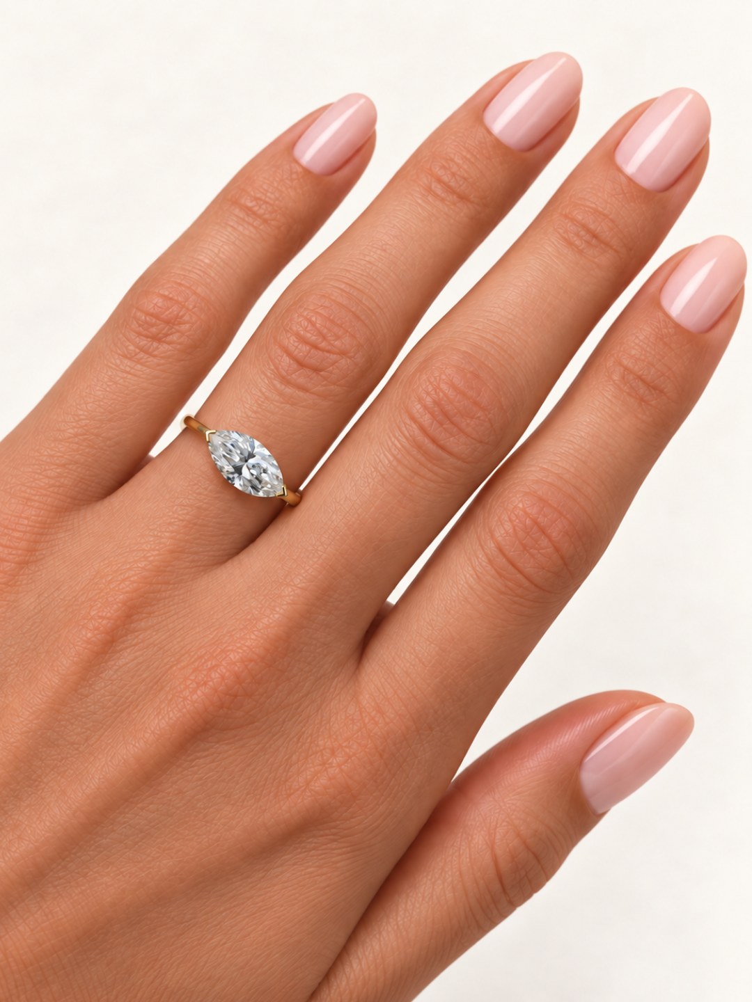 East-west marquise lab diamond ring worn on hand