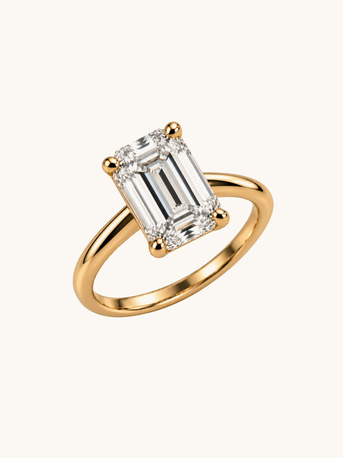 Emerald cut lab diamond ring in 14k yellow gold, angled view