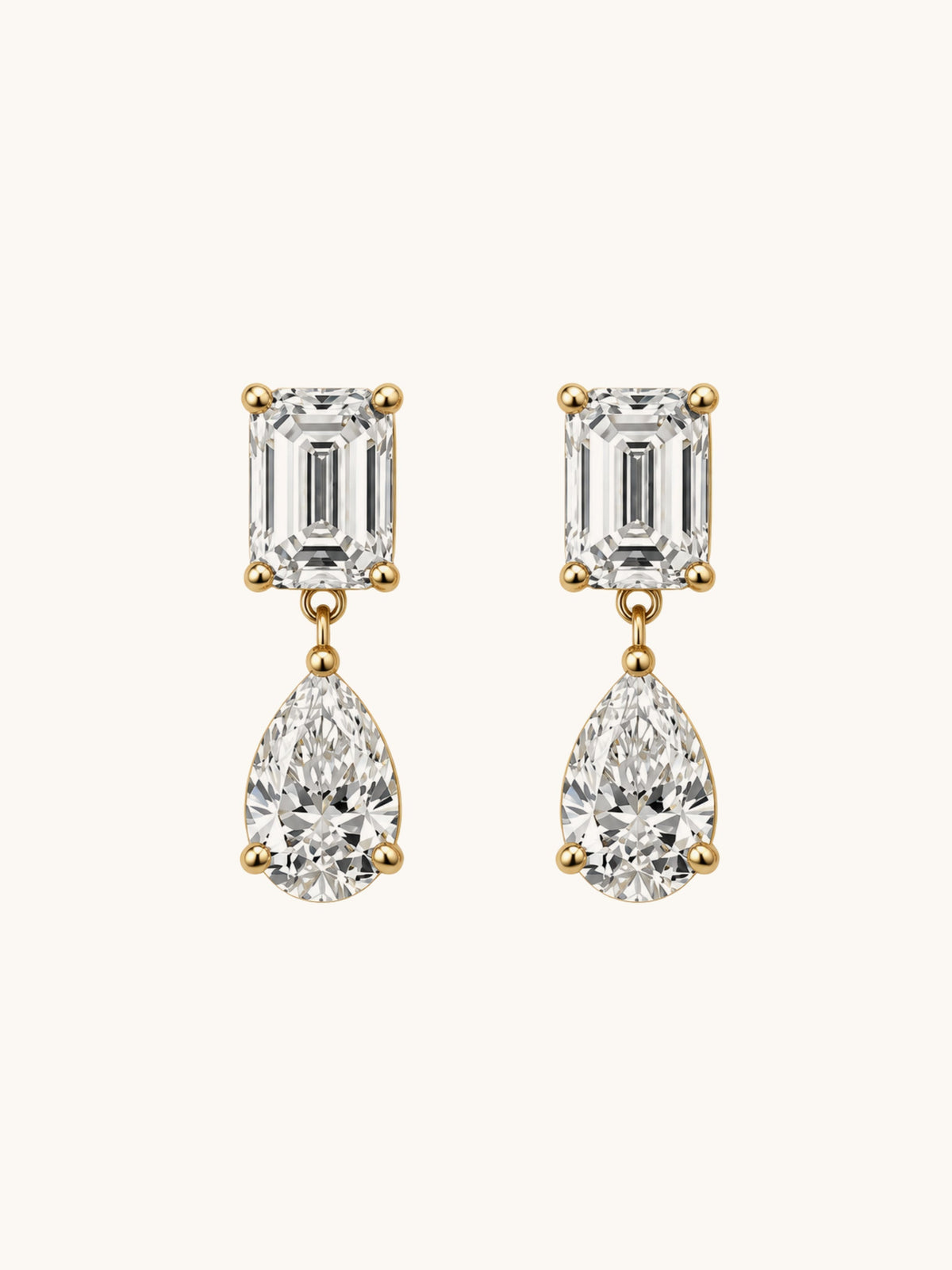 Emerald cut and pear lab diamond drop earrings in 14k yellow gold, front view